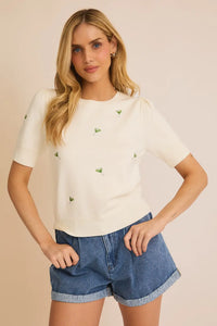 White puff sleeve embroidered knit top featuring delicate butterfly embroidery details