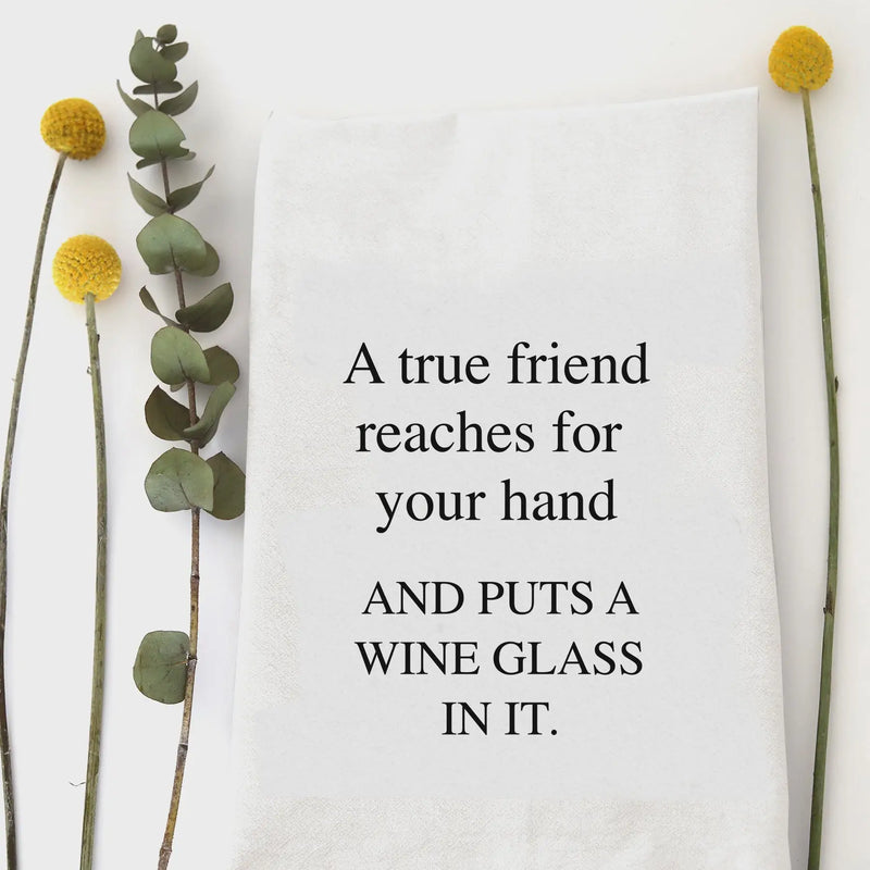 White hand tea towel featuring a humorous quote about true friendship