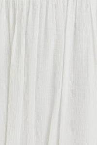 White textured fabric with vertical folds for smocked spaghetti strap crop top from Daisy Lane Offers