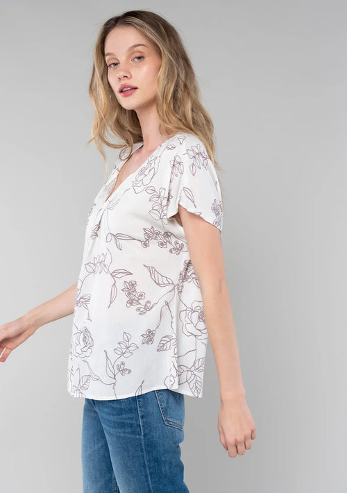 White floral short dolman blouse with short dolman sleeve and button front detail