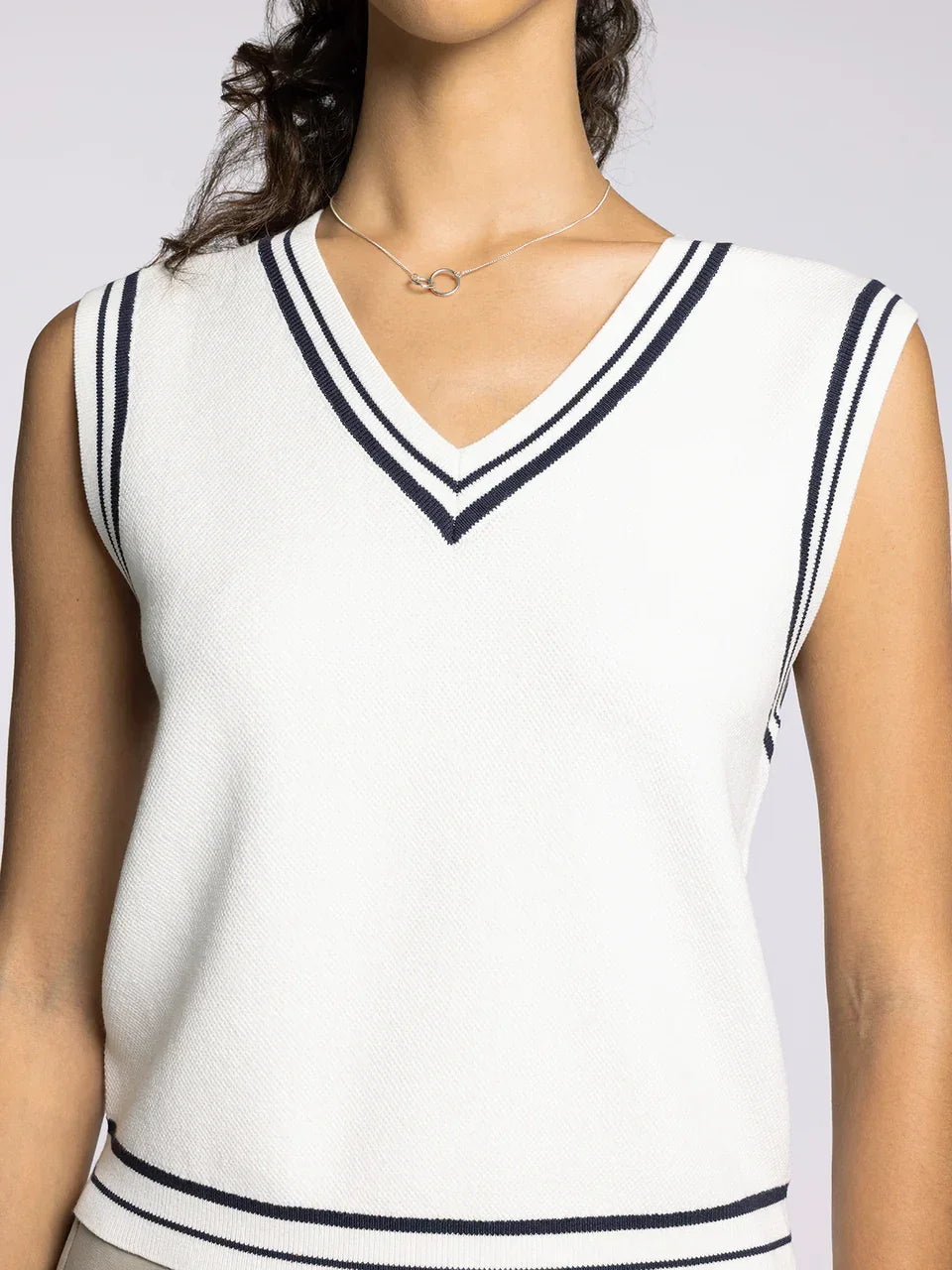 White V-neck sleeveless top with navy blue stripes, part of the Supply Jessie vest collection