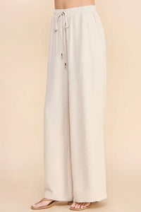 White wide-leg AIRY DRAWSTRING PANTS with pockets and drawstring waist for comfort