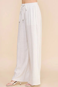 White Striped Linen Smock Waist Pants with textured vertical stripes and drawstring waist