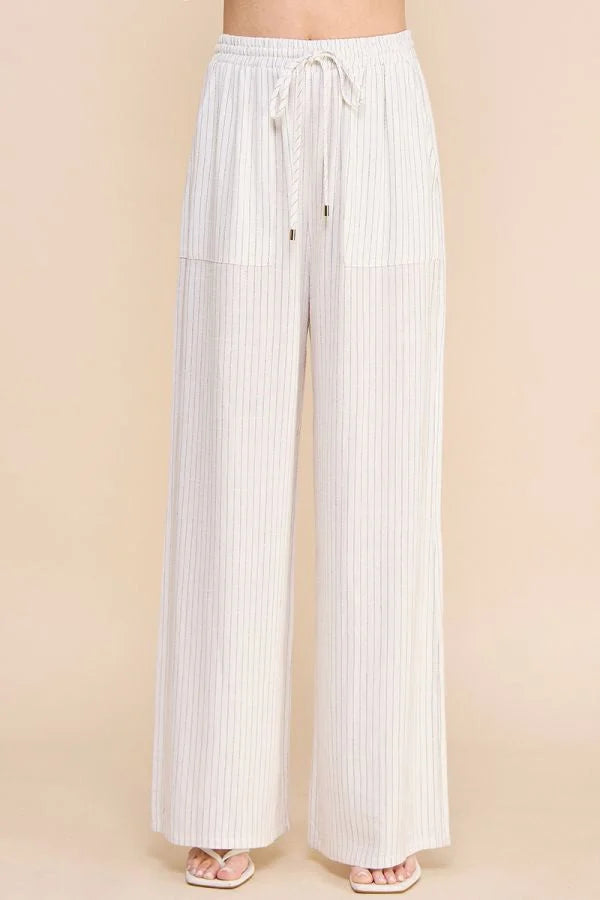 White wide-leg STRIPED LINEN SMOCK WAIST PANTS with a drawstring waist for a stylish look