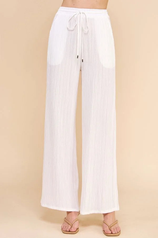 White textured woven adjustable tie waist pants with a drawstring for stylish comfort