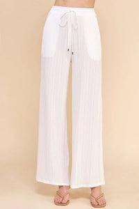 White textured woven adjustable tie waist pants with a drawstring for stylish comfort