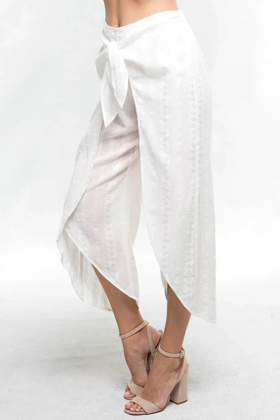 White flowy wrap-style skirt with asymmetrical hemline for the free spirit