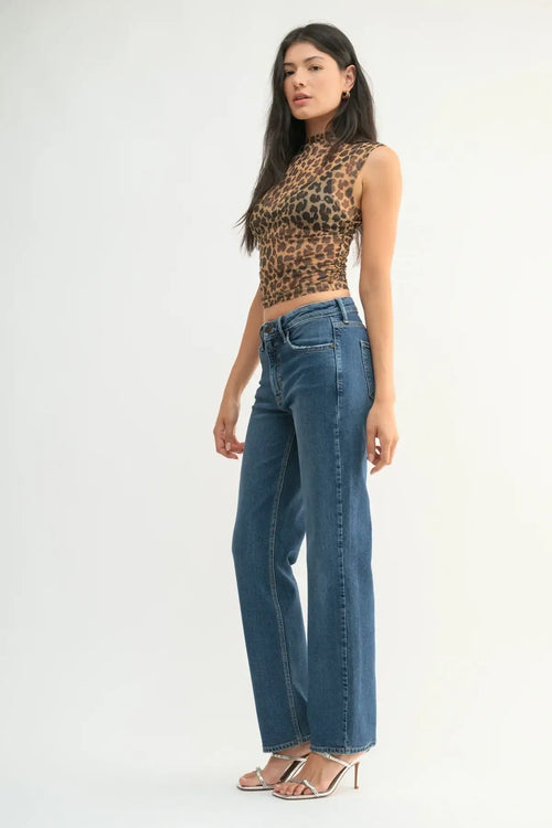 Wide-leg blue denim jeans with leopard print top from Shop Daisy’s women’s boho chic clothing