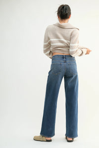 Wide-leg blue denim mid rise jeans with light stretch for a stylish, comfortable fit