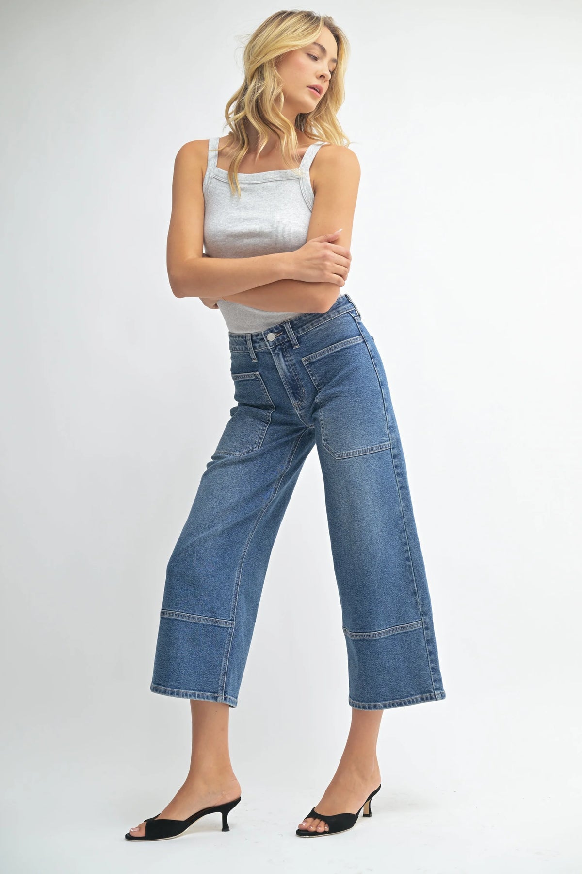 High rise cropped wide leg denim jeans in dark wash with distressed details
