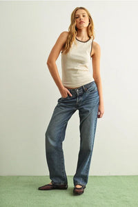 Wide-leg medium-wash denim jeans with color contrasted tank top