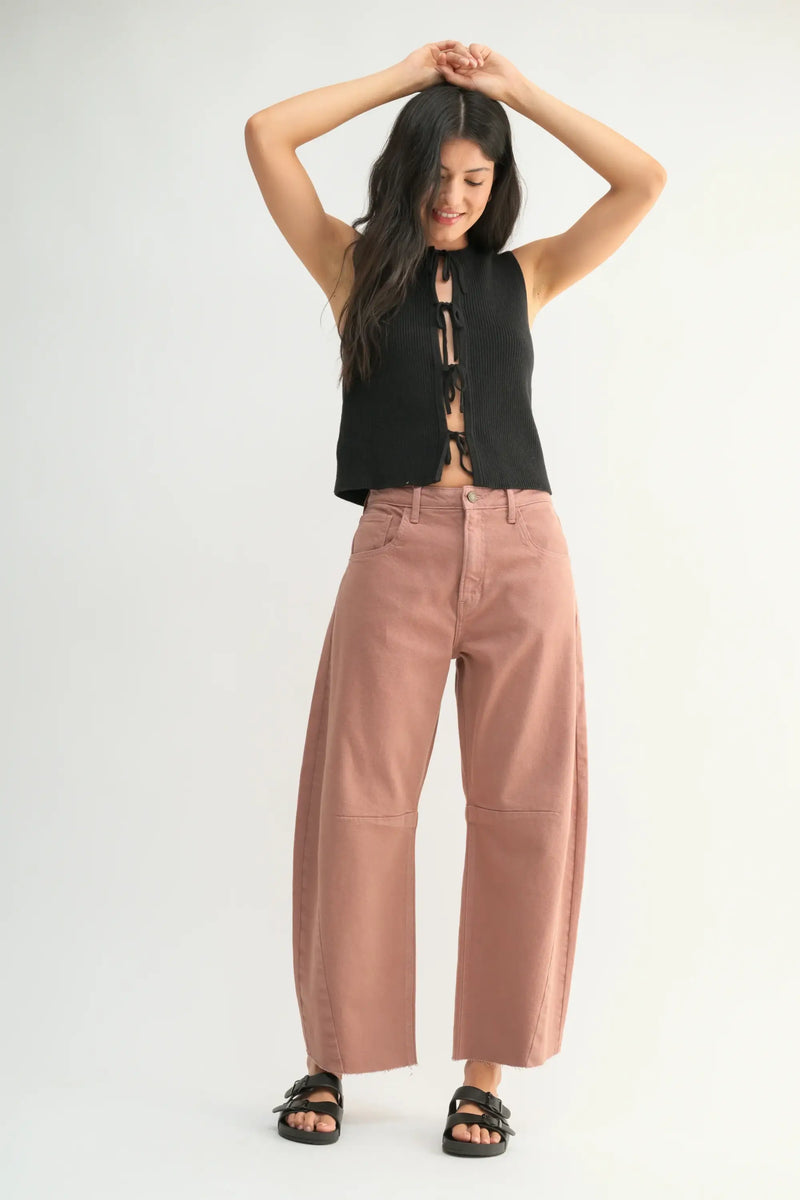 Wide-leg dusty rose pants with a black sleeveless top styled with Seamed Barrel Wild Leg Denim Jeans