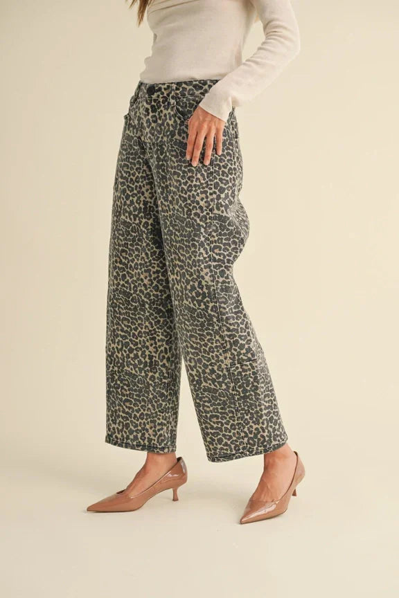 Wide-leg leopard print barrel pants styled with cream sweater and pink heels