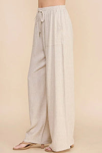 Wide-leg striped linen smock waist pants with vertical pinstripes and drawstring