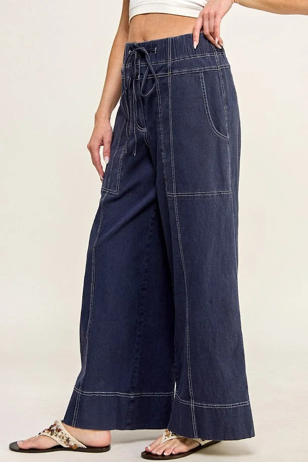 Wide leg navy blue cotton twill pants with contrast stitching and drawstring waist