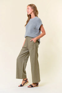 Wide-leg olive green linen pants with elastic waist styled for women’s boho chic clothing