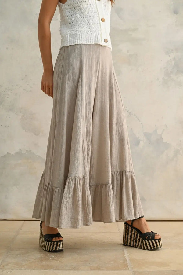 Daisy Lane’s wide-leg cotton pants feature a unique ruffled fashionable silhouette