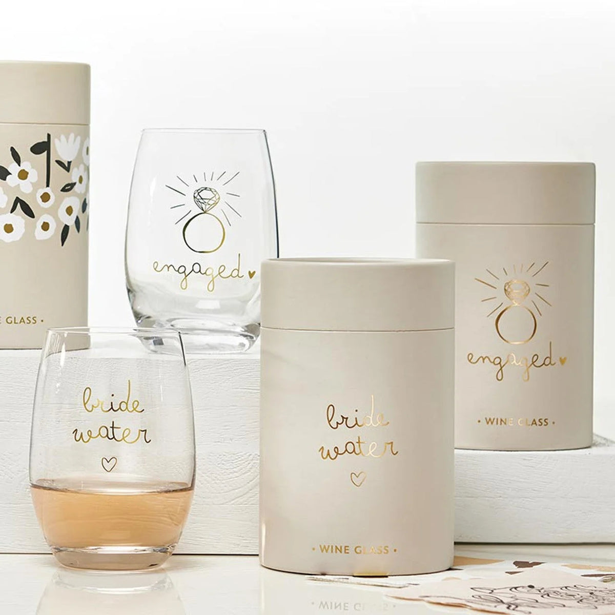 Gold foil stemless wine glass with celebratory designs for engaged occasions