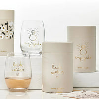 Gold foil stemless wine glass with celebratory designs for engaged occasions