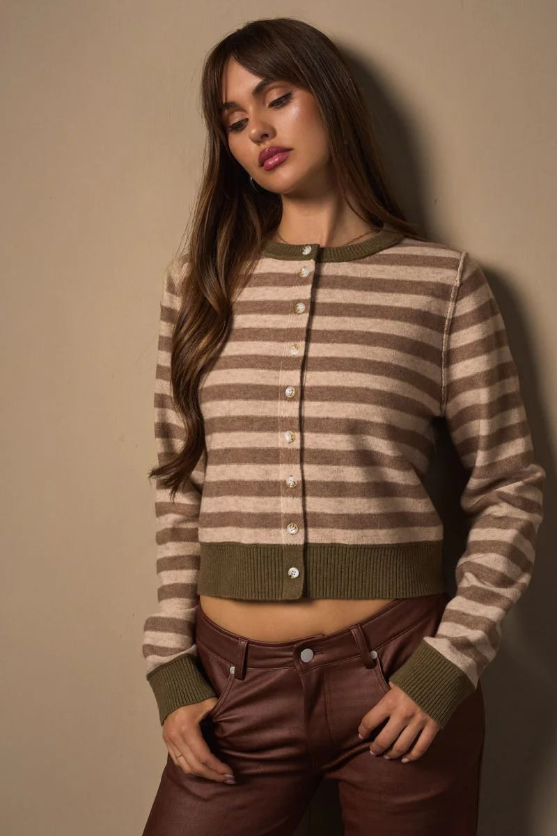 Woman wearing a long sleeve stripe KINT cardigan with beige and brown stripes
