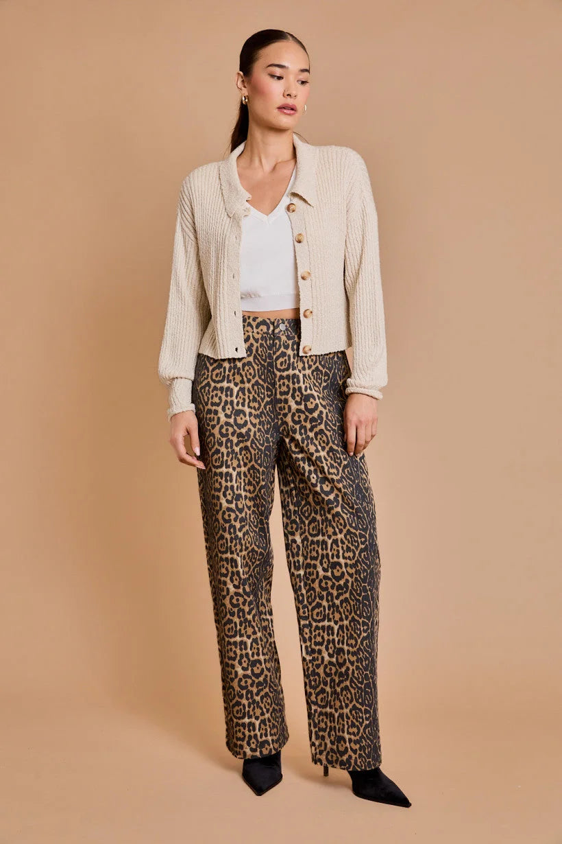 Woman in beige cardigan and white top wearing Animal Print Leopard Twill Pants