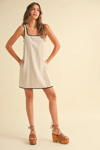 Women’s boho chic clothing: beige linen sleeveless piping detail dress with platform sandals