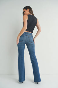 Woman in black top and blue slim fit bootcut jeans, ladies slim bootcut jeans style