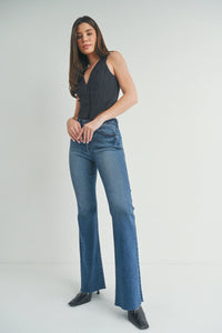 Woman in black top and blue Ladies Slim Bootcut Jeans showcasing slim fit bootcut jeans style