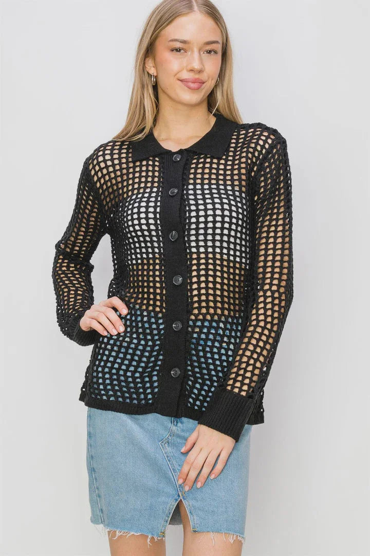 Woman showcasing an open knit collared cardigan with long sleeves and stylish holes