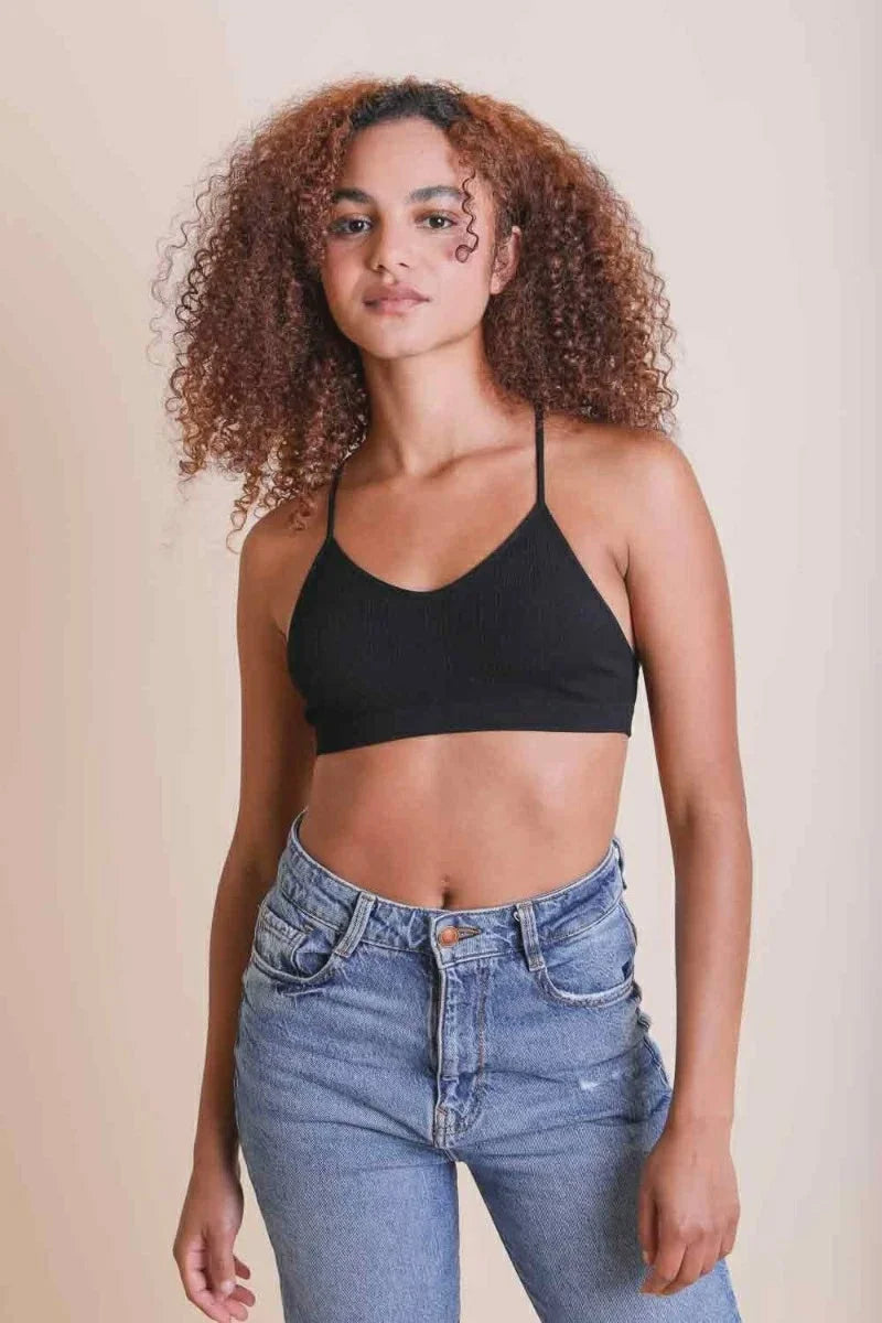 Woman modeling Tattoo Mesh Racerback Bralette with black crop top and jeans