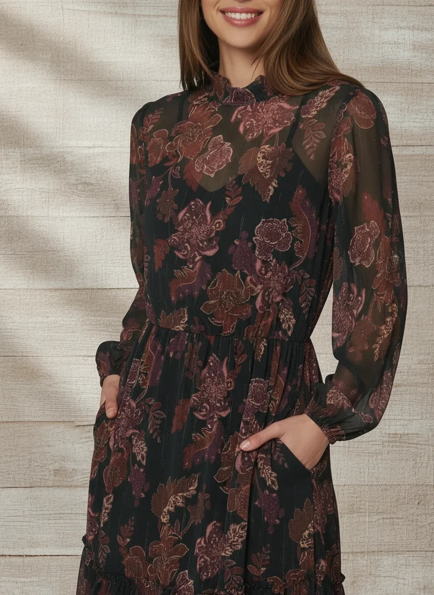 Woman in black floral bohemia maxi dress with pockets and mock neck for LOST + WANDER