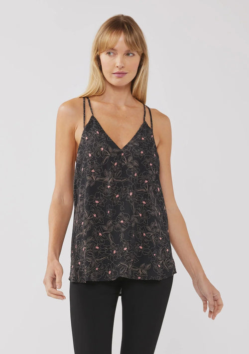 Woman wearing floral print spaghetti strap swing tank top with black camisole and pants