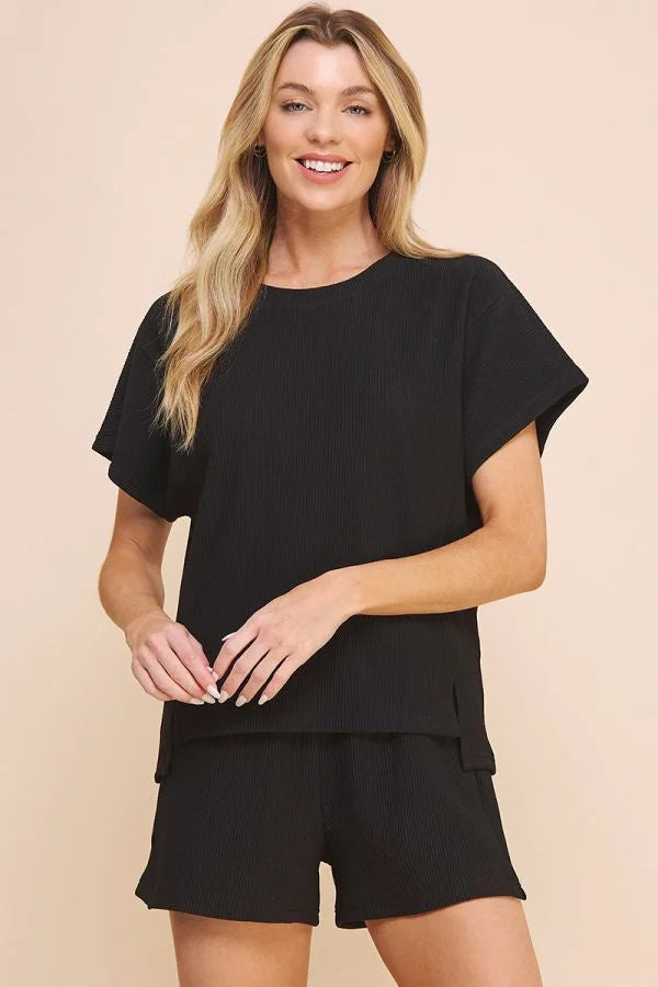 Woman modeling an Easy Textured Knit Top with matching black shorts