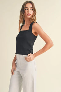 Woman in black sleeveless top and light pants modeling Mini Ribbed Squared Neck Knitted Top