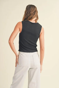 Woman in a black sleeveless top showcasing the Mini Ribbed Squared Neck Knitted design