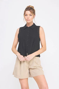 Woman in black pintuck sleeveless collared shirt with lace trims by Daisy Lane