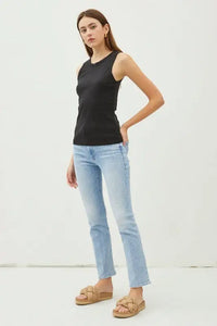 Woman in a black tank top and blue jeans from BASIC SOLID RAISED HEM COTTON CREW NECK TANK
