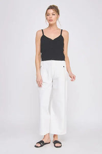 Woman wearing COTTON ELASTIC BACK WAIST PANTS with stretchy waistband and accent buttons