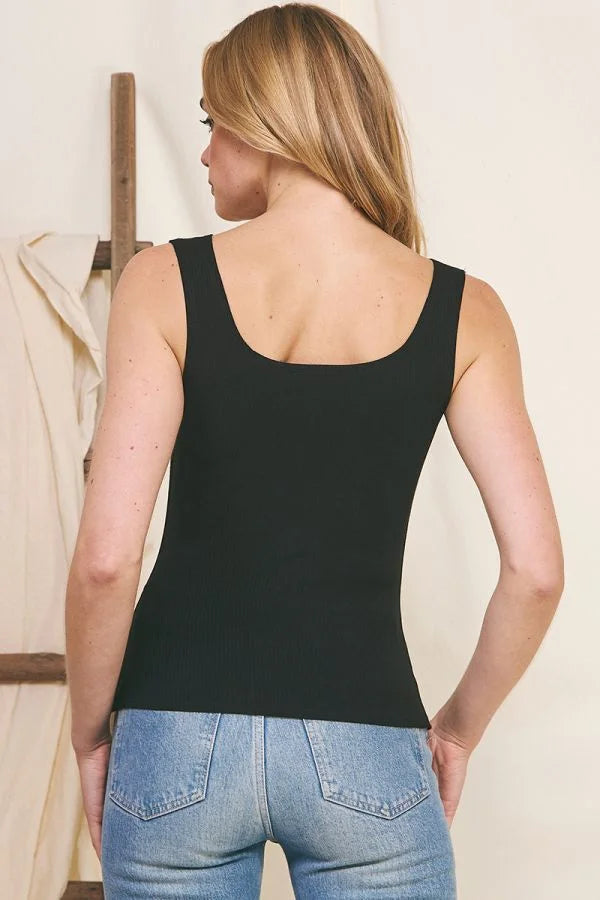 Woman in a Ribbed Knit V Cut-Out Square Neck Tank and blue jeans, viewed from behind