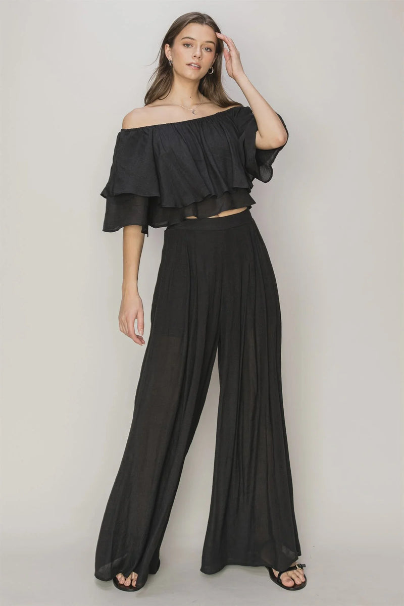 Woman showcasing a chic Off Shoulder Top and Palazzo Pants set for a flowy silhouette