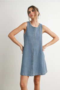 Woman wearing a blue striped sleeveless denim mini dress, stylish denim mini dress for women