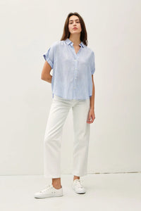 Woman wearing shoulder shirring stripe top in women’s boho chic clothing at Shop Daisy