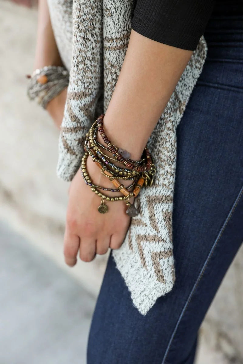 Woman models Bohemian Stone and Bead Stack Bracelet with a stylish sweater