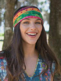 Woman wearing a colorful boho bandeau headband from the FULL BOHO BANDEAU collection