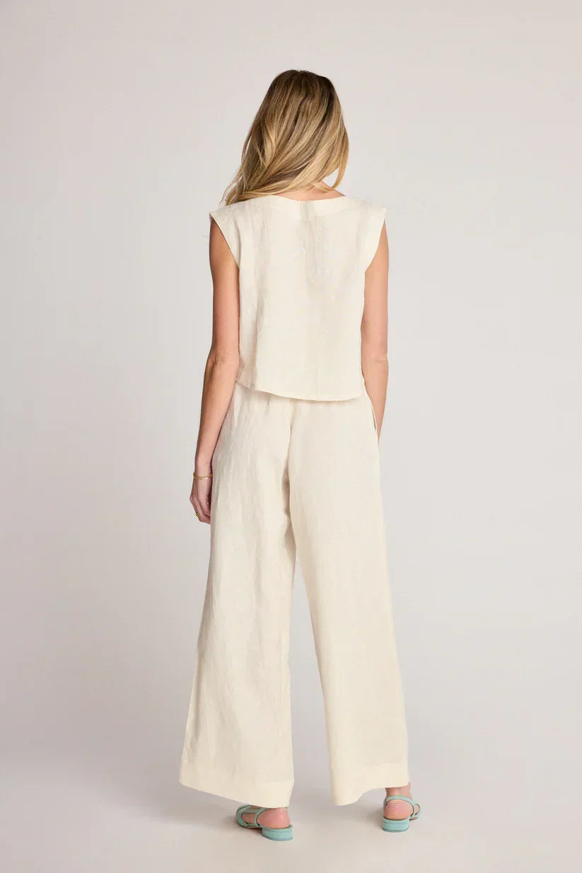 Woman wearing cream-colored two-piece outfit from Sunday Ritual Dahlia Pants, perfect for women’s boho chic clothing