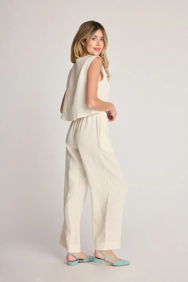 Woman in a cream-colored two-piece outfit showcasing SUNDAY RITUAL DAHLIA PANTS for women’s boho chic clothing