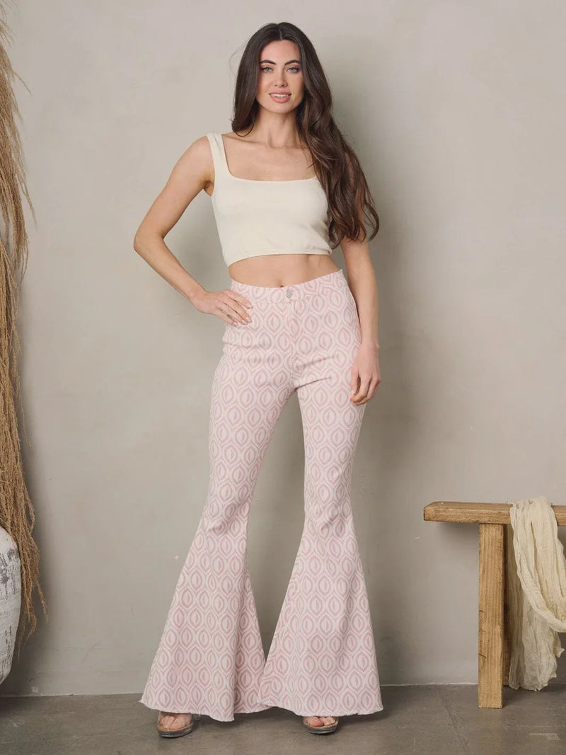 Woman in crop top and flared pants showcasing Bell Bottoms Multi Print Denim Pants