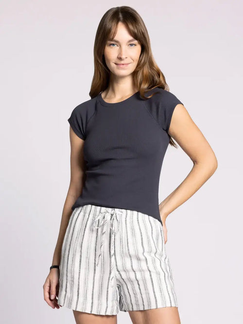 Woman wearing a dark blue THREAD & SUPPLY WINSLET TEE with crew neckline and striped shorts