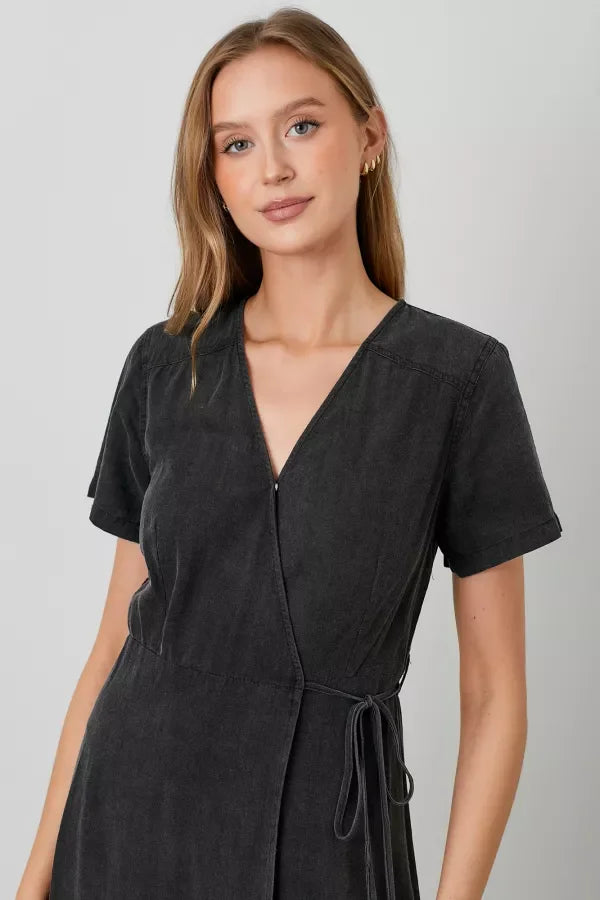 Woman in a dark gray Chambray Wrap Midi Dress with short sleeves