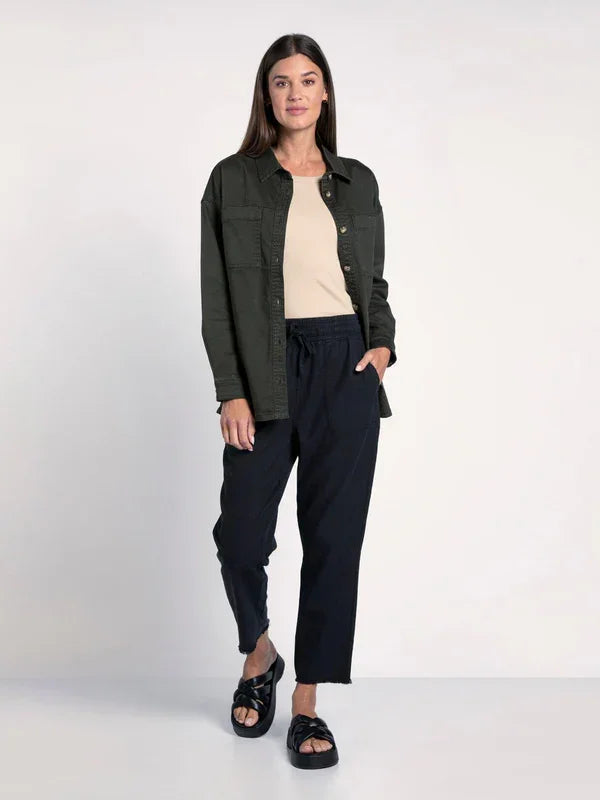 Woman models a Denim Berkley Jacket over a light top and dark pants